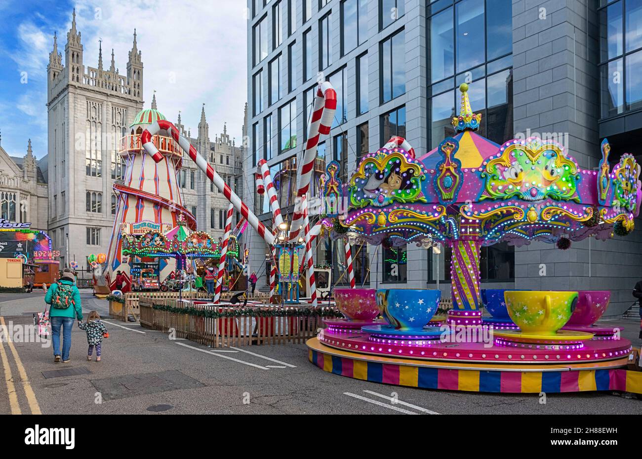 ABERDEEN CITY SCOTLAND UPPERKIRKGATE  ABERDEEN CHRISTMAS VILLAGE FUNFAIR WITH COLOURFUL CAROUSELS Stock Photo