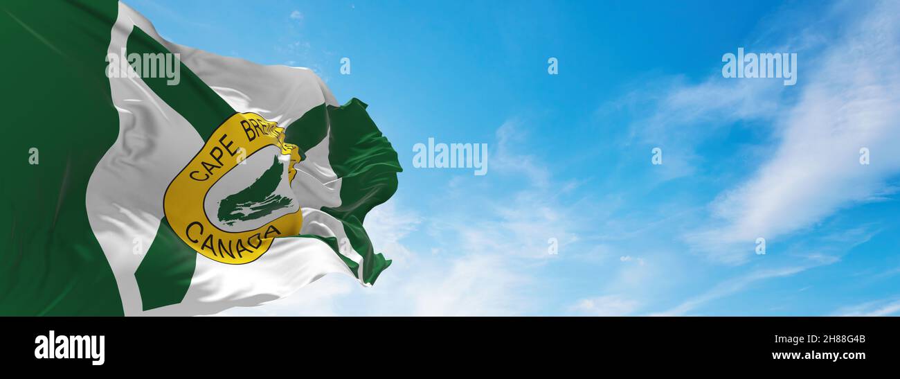 flag of Cape Breton Island , Canada at cloudy sky background on sunset, panoramic view. Canadian travel and patriot concept. copy space for wide banne Stock Photo