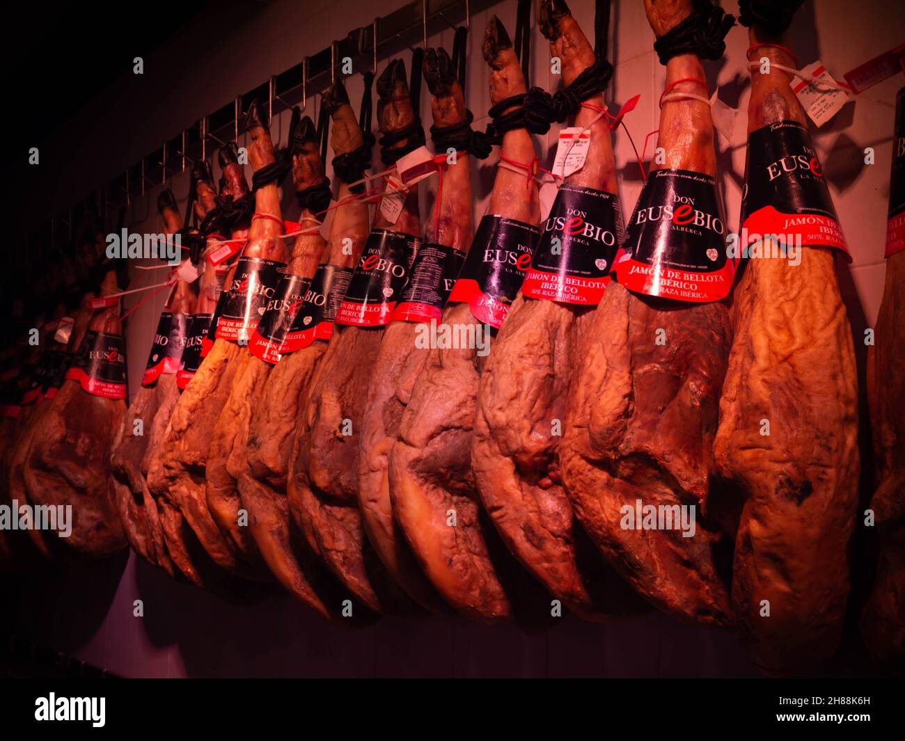 LA ALBERCA, SPAIN - November 21, 2021:  Jamon iberico at the shop showcase in La Alberca, Castile and Leon, Spain. Stock Photo