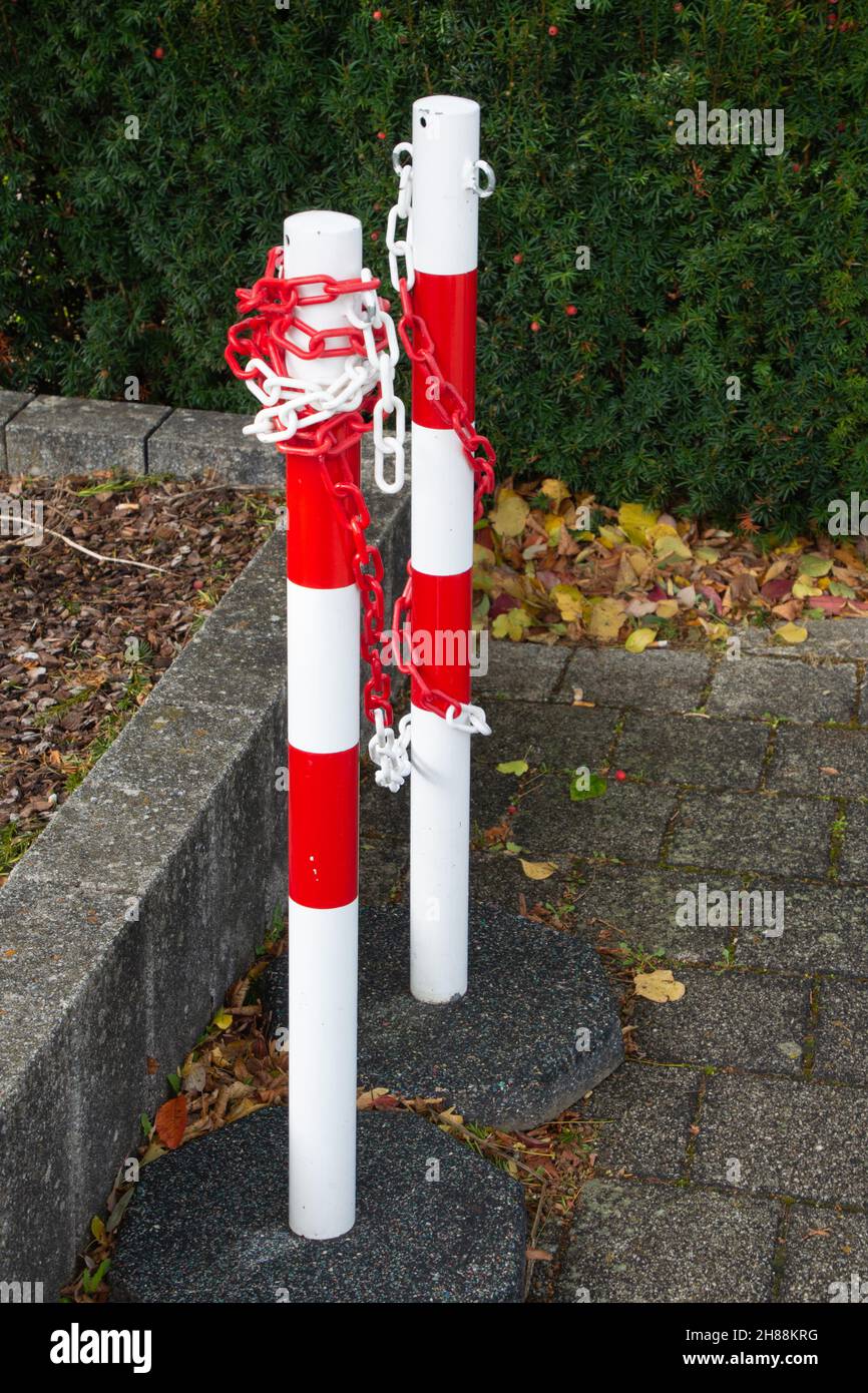 metal Stand chain barriers with red and white chain on construcion site Stock Photo