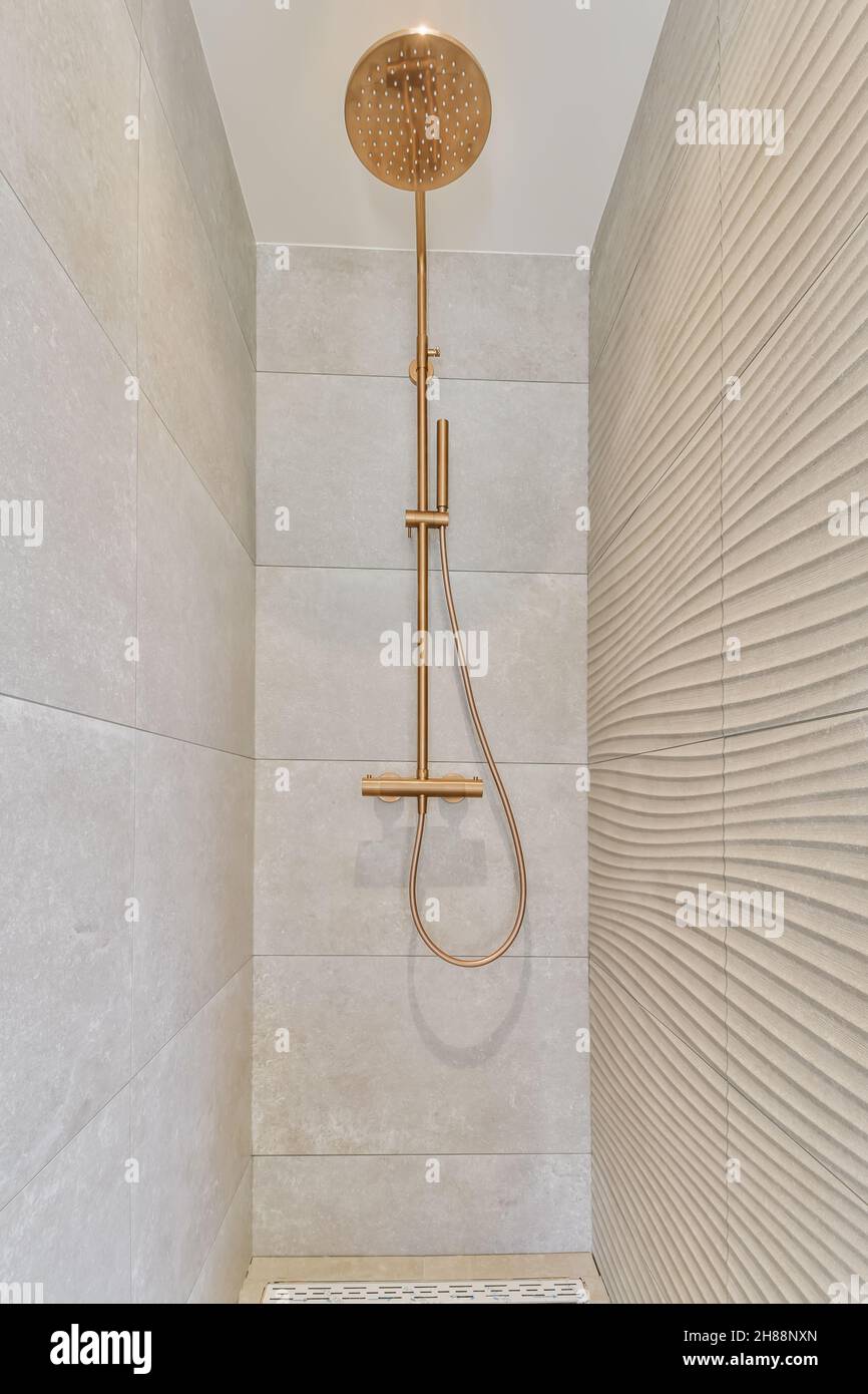 Modern shower cubicle with elegant dark tiles Stock Photo - Alamy