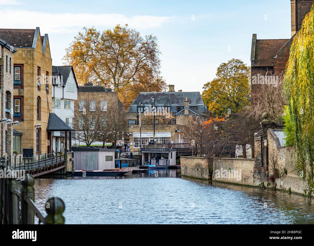 Cambridge, UK – November 18 2021. A view up the River Cam towards Scudamore’s punt tours and punt hire. Captured on a sunny autumn day. Stock Photo