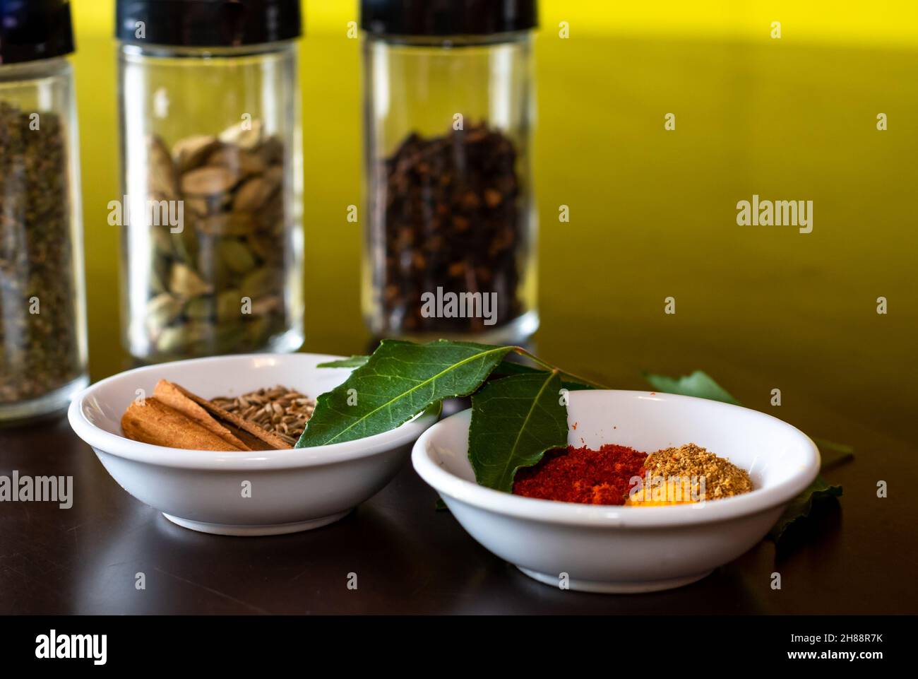 Mixture of Indian spices, whole and ground used to make curry displayed