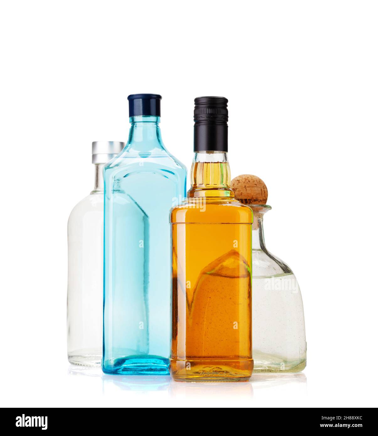 Various hard liquor bottles. Gin, vodka, tequila and whiskey. Isolated