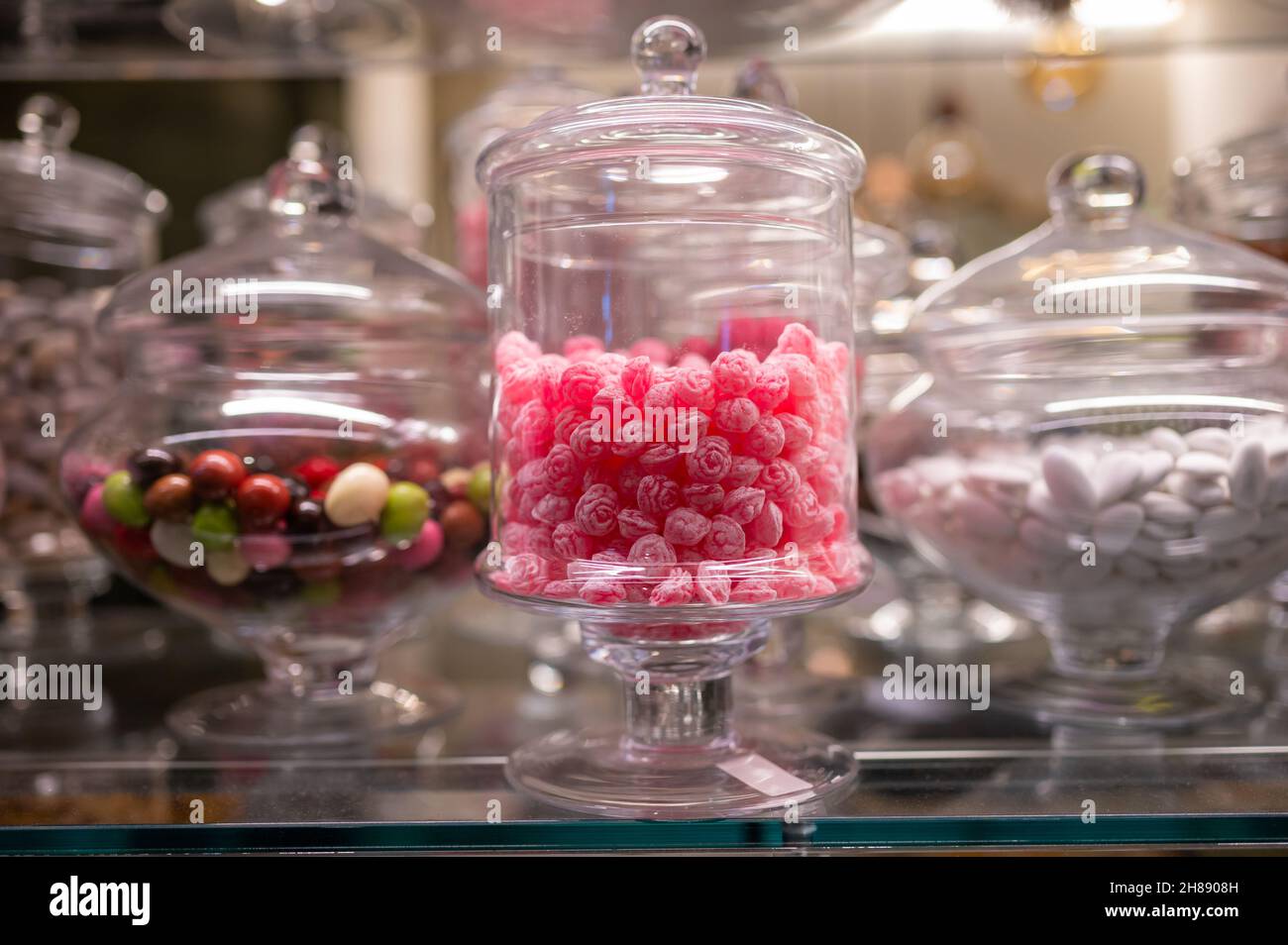 Candy shop display with glass jars filled with jelly candies and bonbons  close up Stock Photo - Alamy
