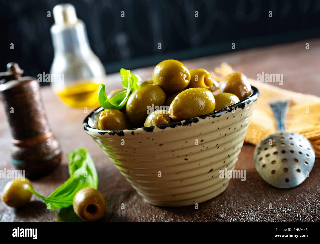 green olives in olive oil Stock Photo Alamy