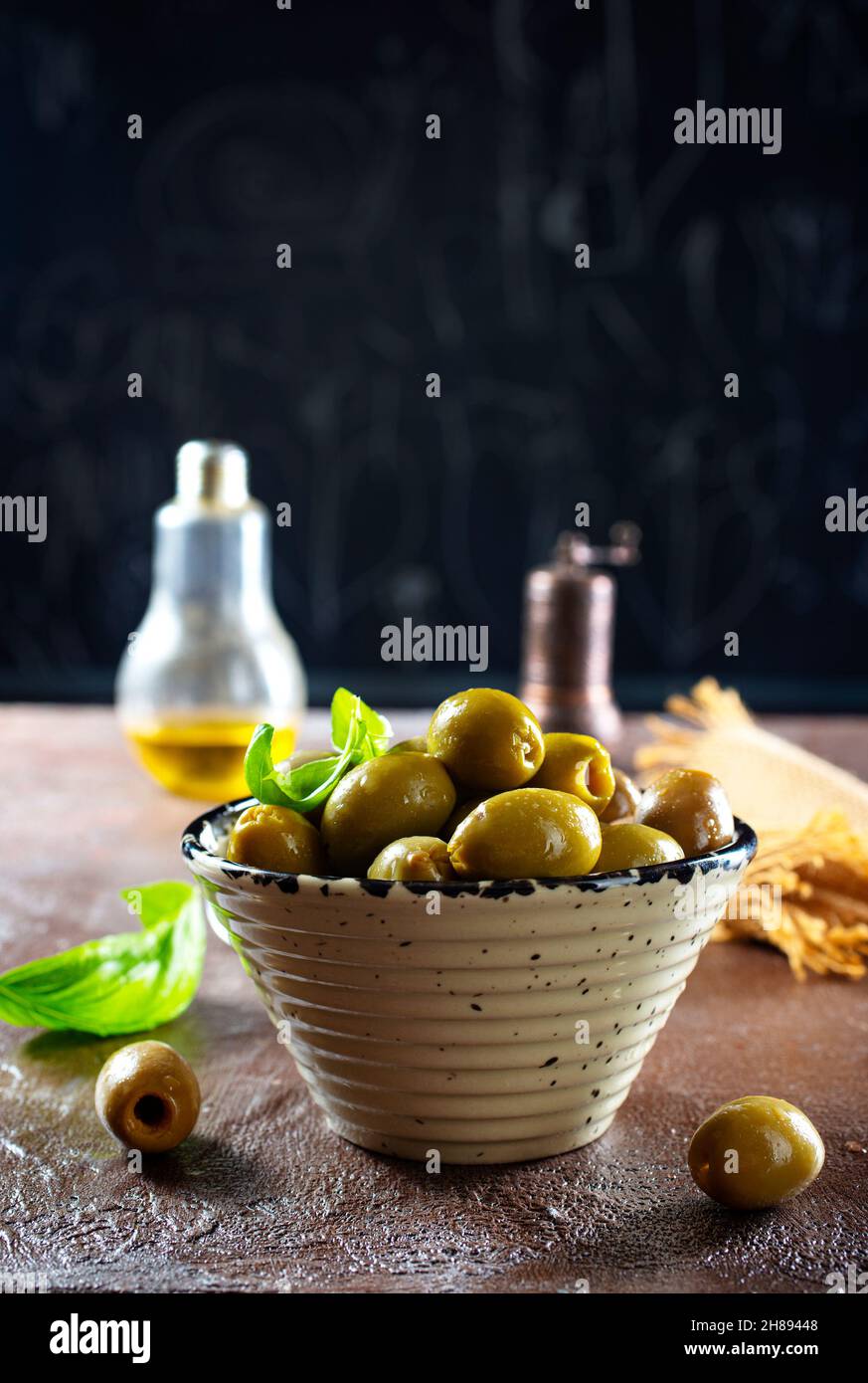 green olives in olive oil Stock Photo Alamy