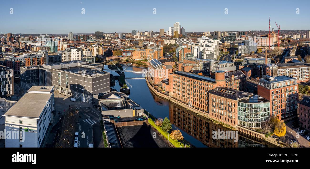 LEEDS, UK - NOVEMBER 22, 2021.  An aerial panorama cityscape of Leeds Dock and city centre skyline with Robert’s Wharf prominent Stock Photo