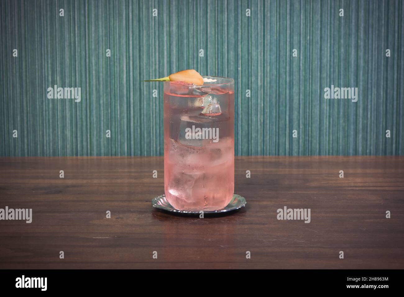 Drink on a wood table, pink gin tonic, fruit cocktail Stock Photo Alamy