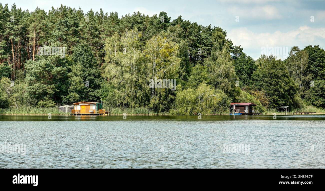 Lonely fishermen's cabins on Lake Pomelsee. Stock Photo