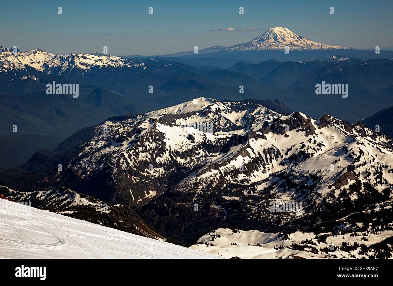 WA19827-00...WASHINGTON - Late afternoon view from Camp Muir overlooking the Tatoosh Range, the Goat Rocks and Mount Adams from Mount Rainier N P. Stock Photo