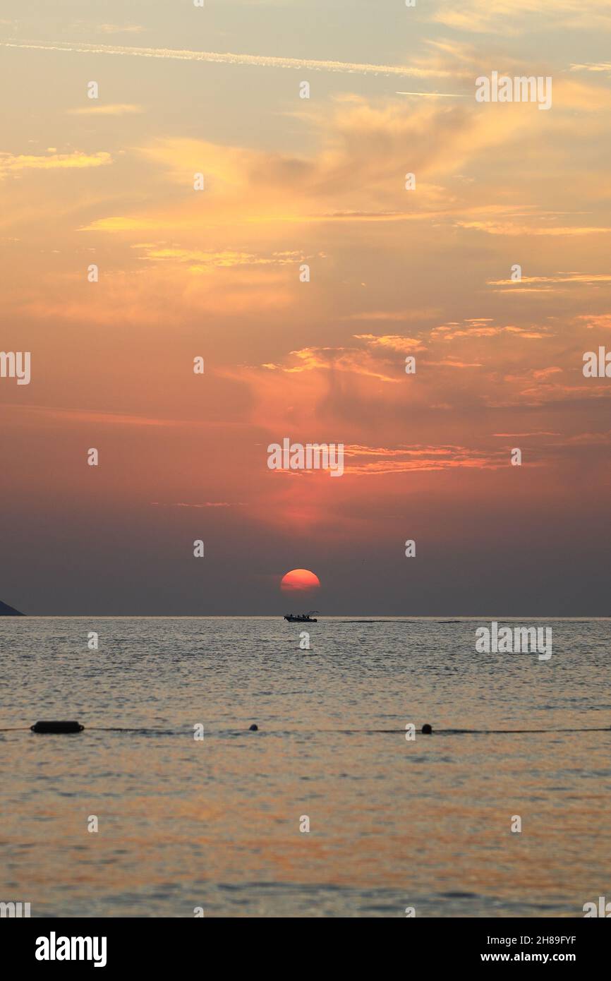 Beautiful sunset over the calm sea with cloud sky background Stock ...