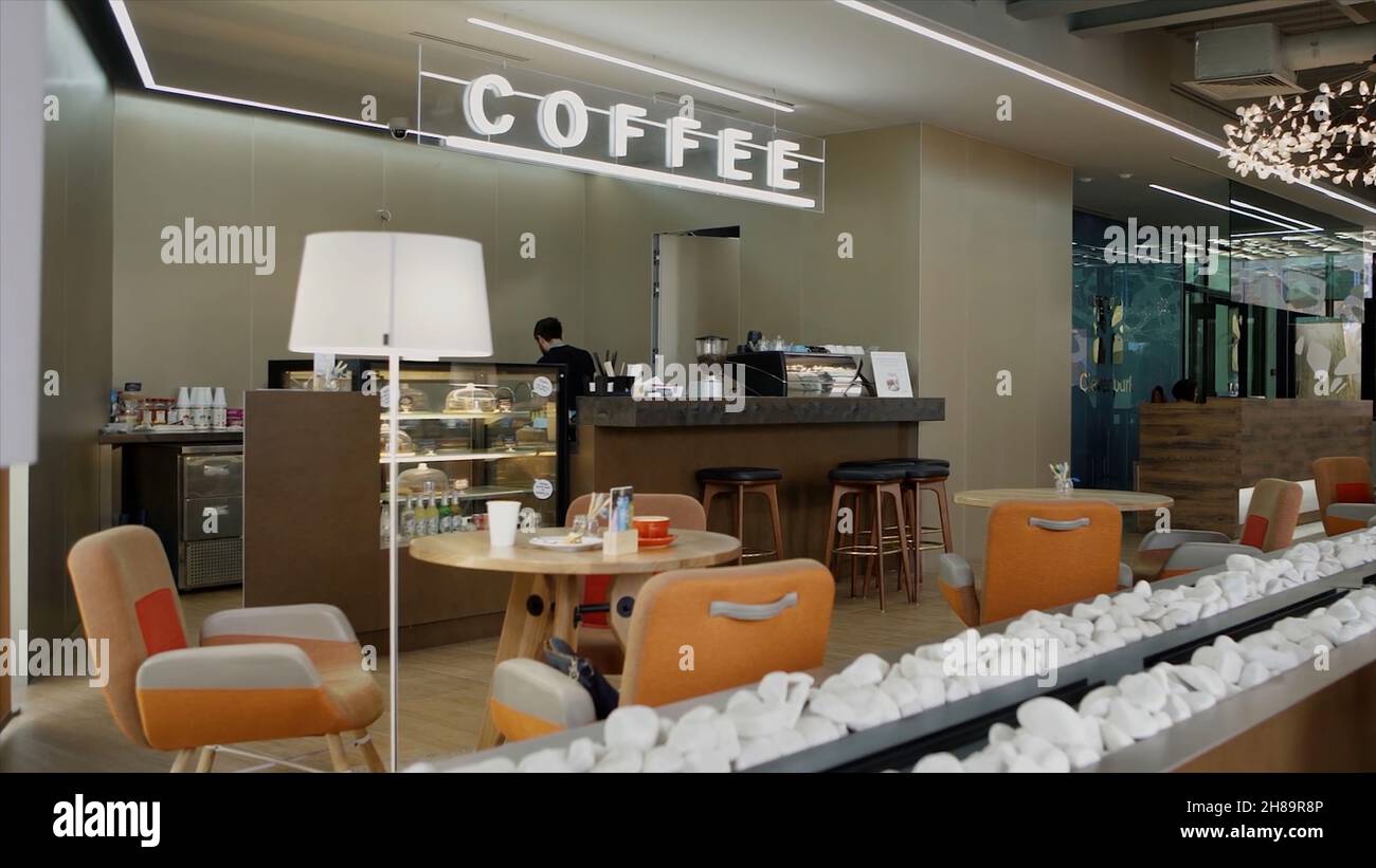 A small cafe with modern design inside shopping center. Video. Interior