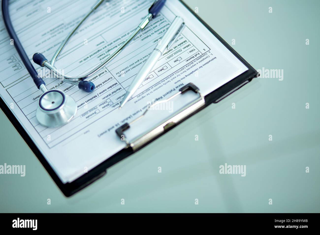 close-up. image of a stethoscope, pen and clipboard on the doctor's desktop. Stock Photo
