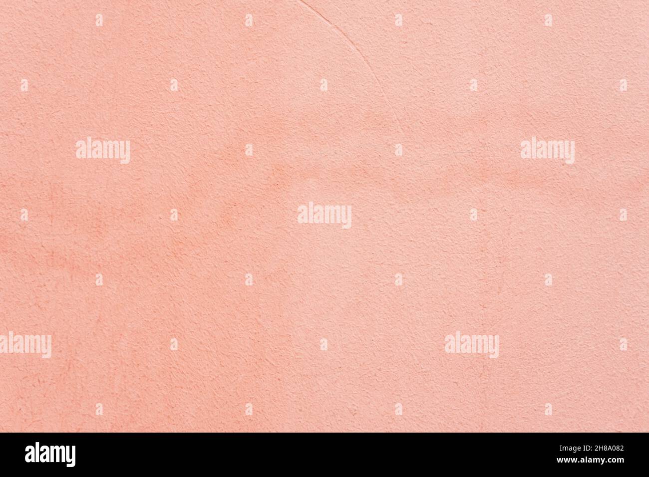 Old plastered wall with, spots. Coral color grunge texture. Abstract background Stock Photo