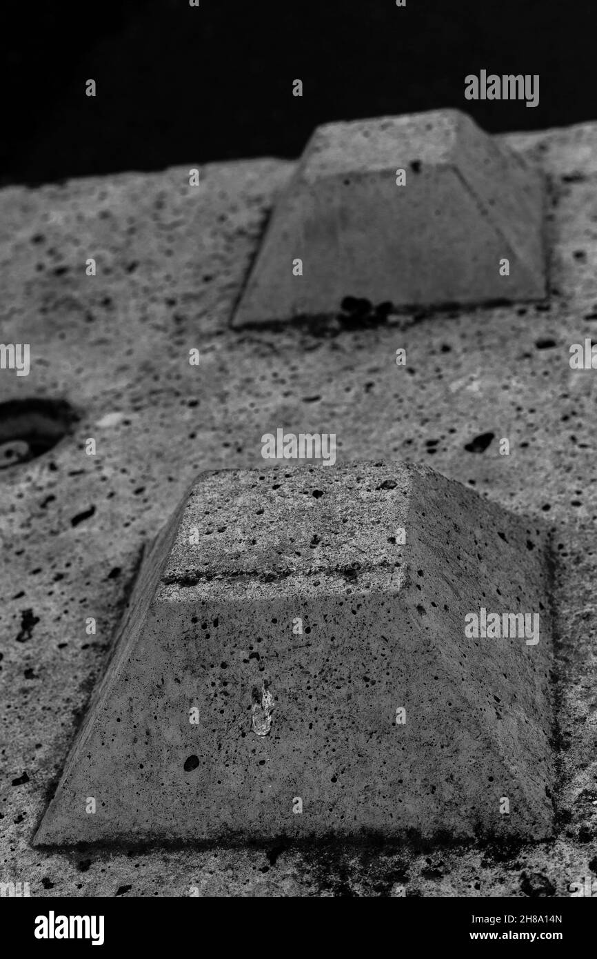 Concrete block detail on a woodland lane. Stock Photo