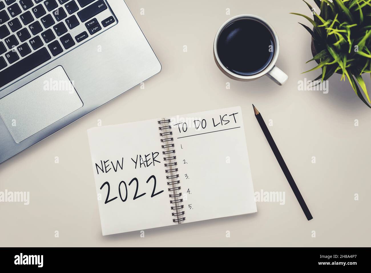 2022 Happy New Year Resolution Goal List and Plans Setting - Business office desk with notebook written about plan listing of new year goals and Stock Photo