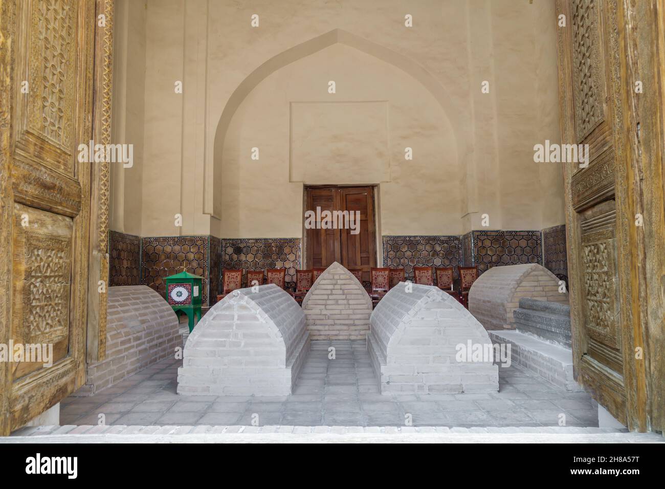 View from street to interior of Rukhabad mausoleum (built in 1380). Ancient gravestones are visible. Shot in Samarkand, Uzbekistan Stock Photo