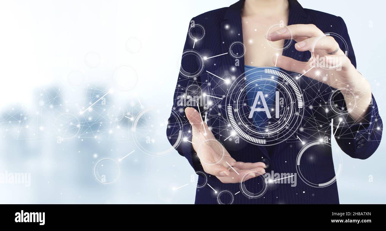 Artificial intelligence AI . Two hand holding virtual holographic Artificial intelligence icon with light blurred background. Data mining technology o Stock Photo