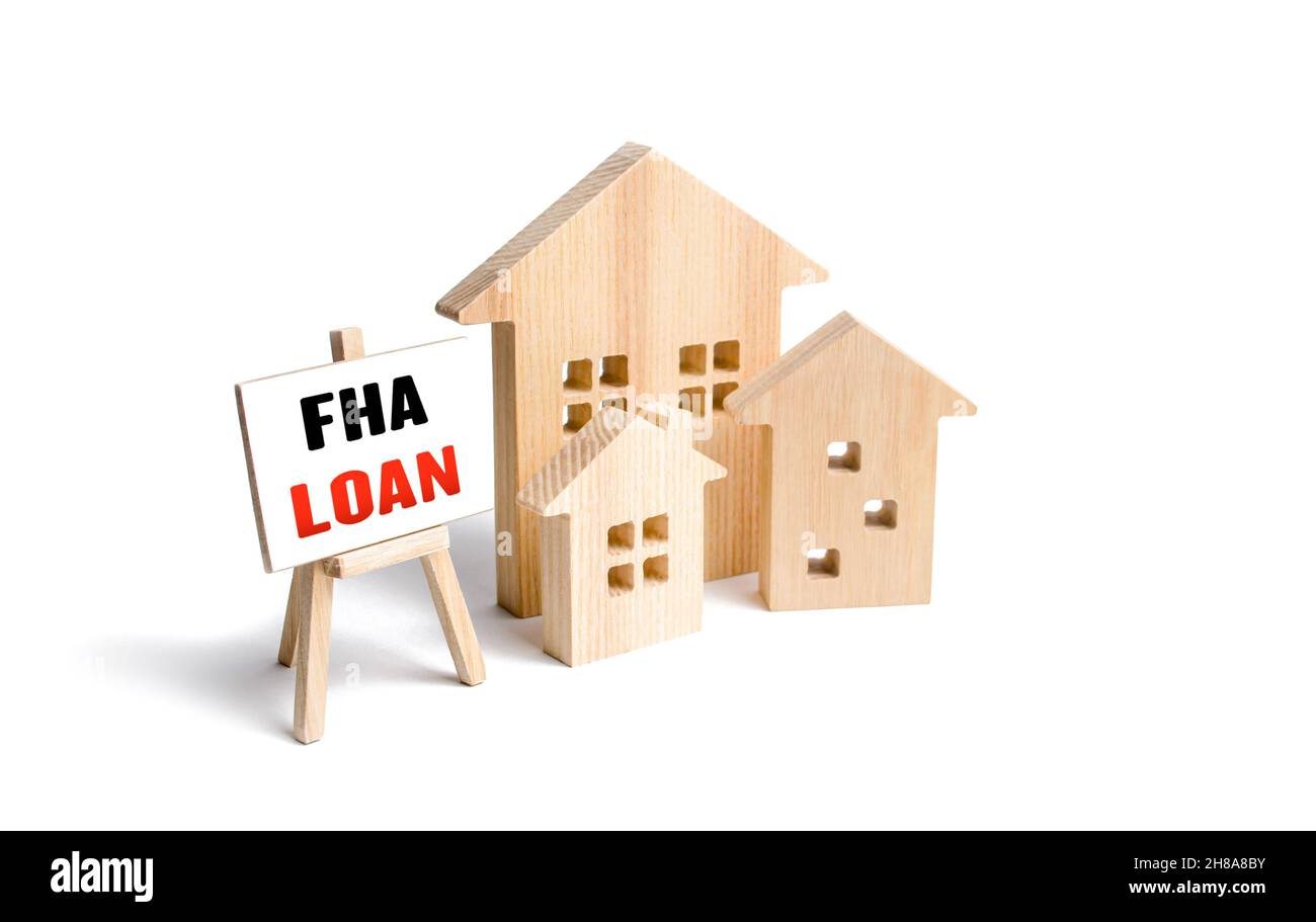 Houses and easel with FHA loan. Mortgage insured by Federal Housing Administration Loan. Affordable loans for borrowers with a low credit score. Down Stock Photo