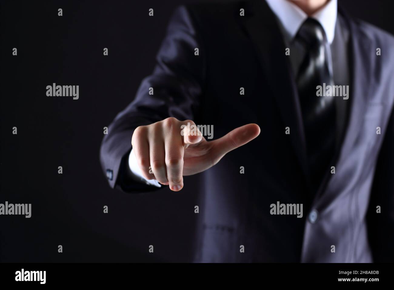 hand pressing a touchscreen button Stock Photo