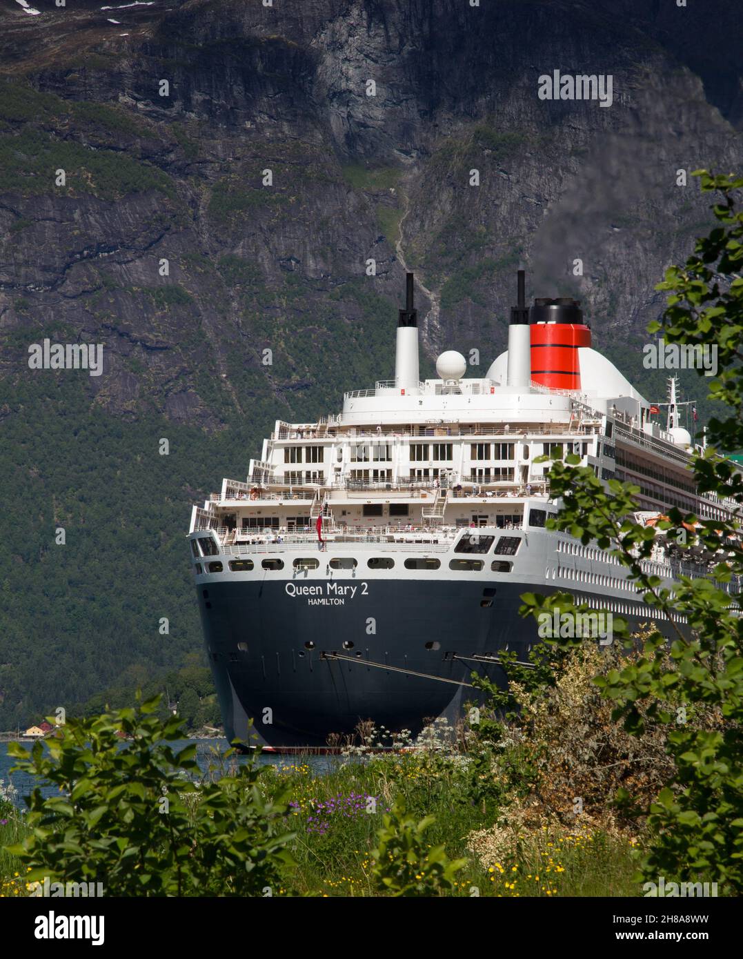 The Cunard Liner Queen Mary 2 moored at Olden in the Nordfjorden, Norway.  Sogn og Fjordane county. Stock Photo
