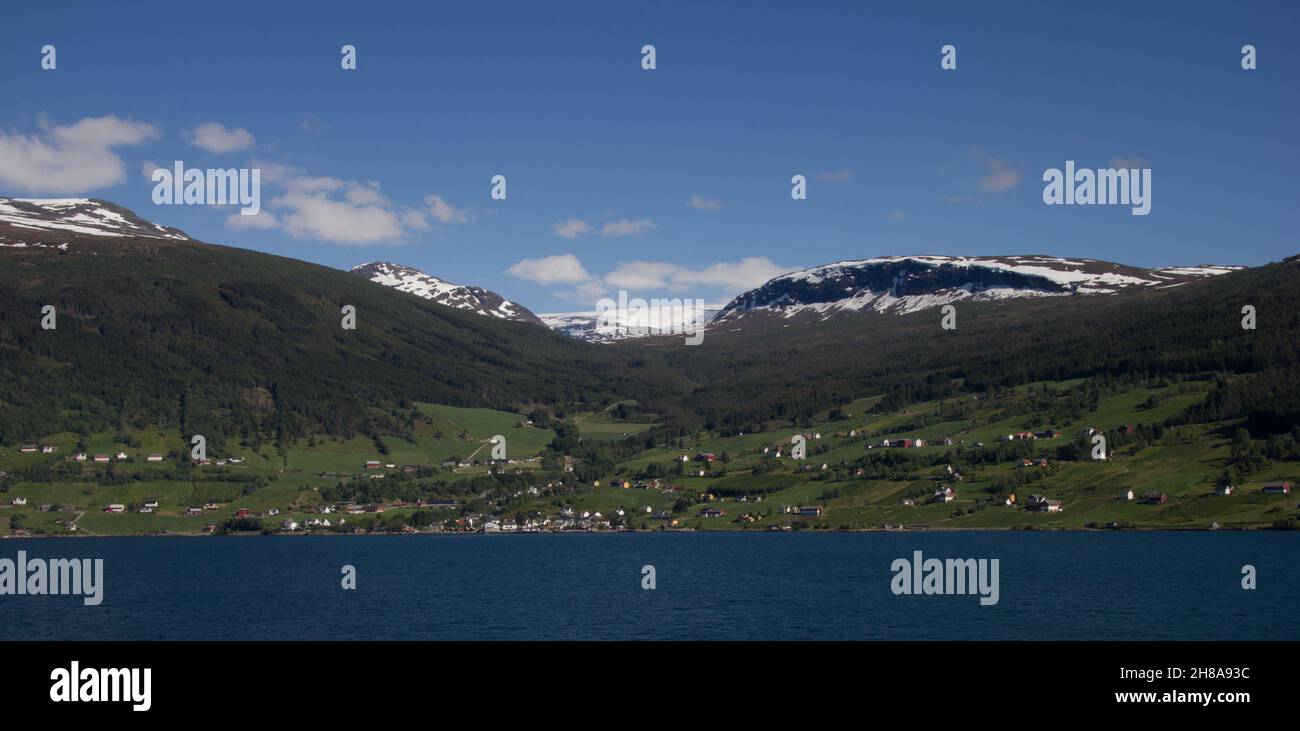 Hamlet or village on the shore of Nordfjorden, Norway.    Sogn og Fjordane county. Stock Photo