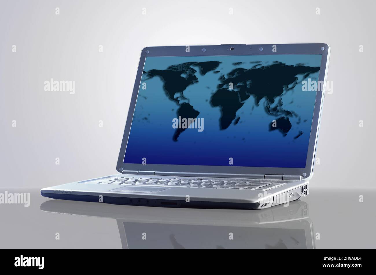 Digital interface world map graphs - Laptop With A Map Of The World 2H8ADE4