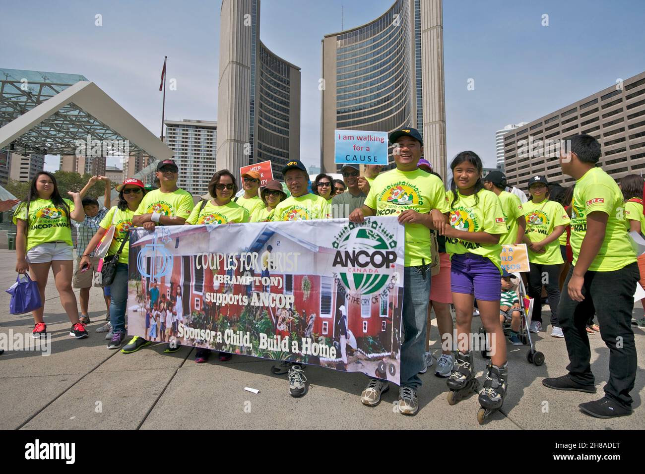 Toronto, Ontario, Canada - 08/25/2013: Protestors holding banners and placard against the Canadian government on the issue on sponsor child in Philipi Stock Photo