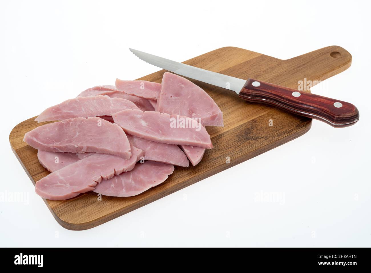 Slices of smoked ham - white background Stock Photo