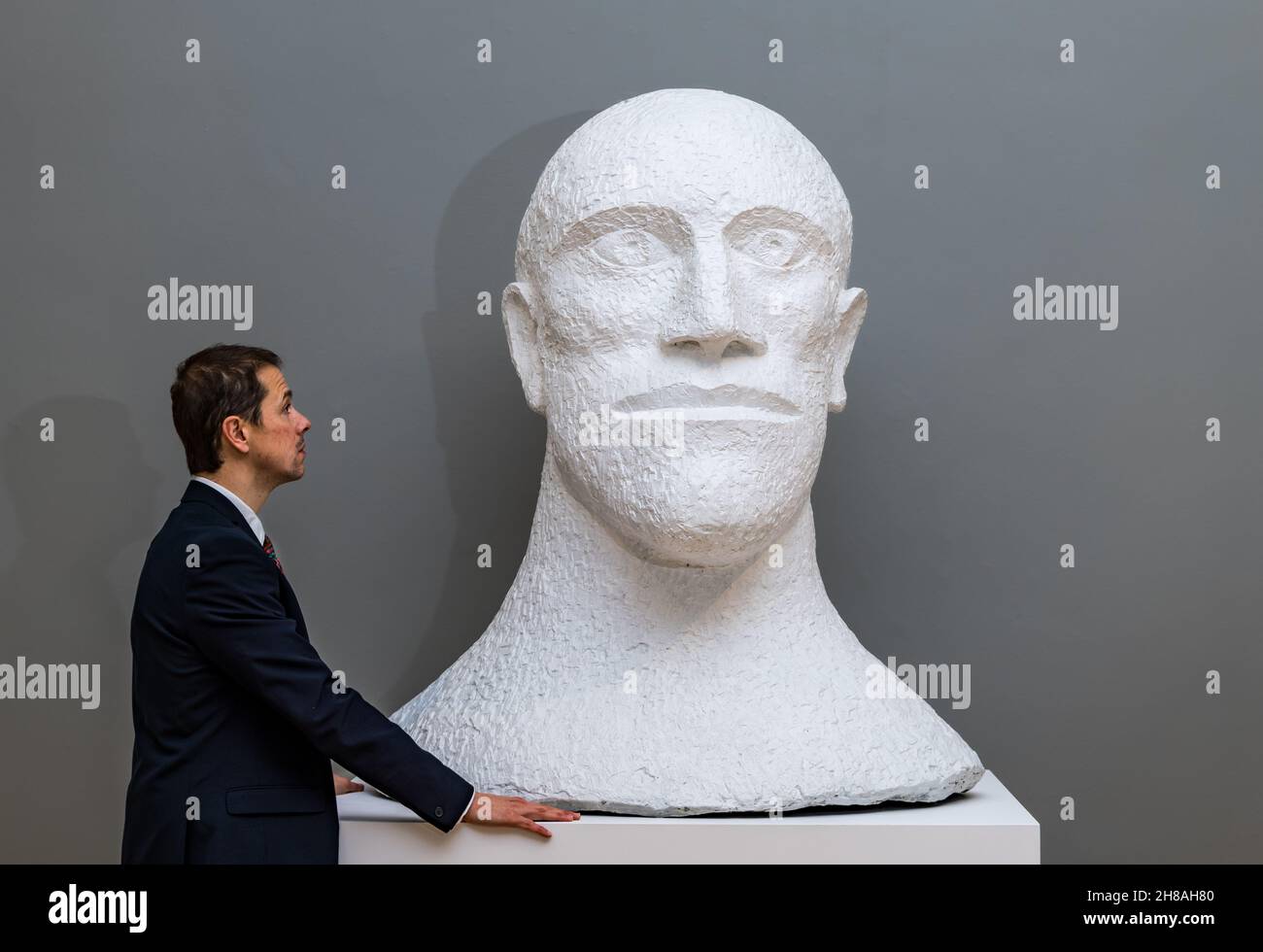 Man admiring a modern art sculpture by sculptor Elisabeth Frink, Scottish National Gallery of Modern Art, Edinburgh, Scotland, UK Stock Photo