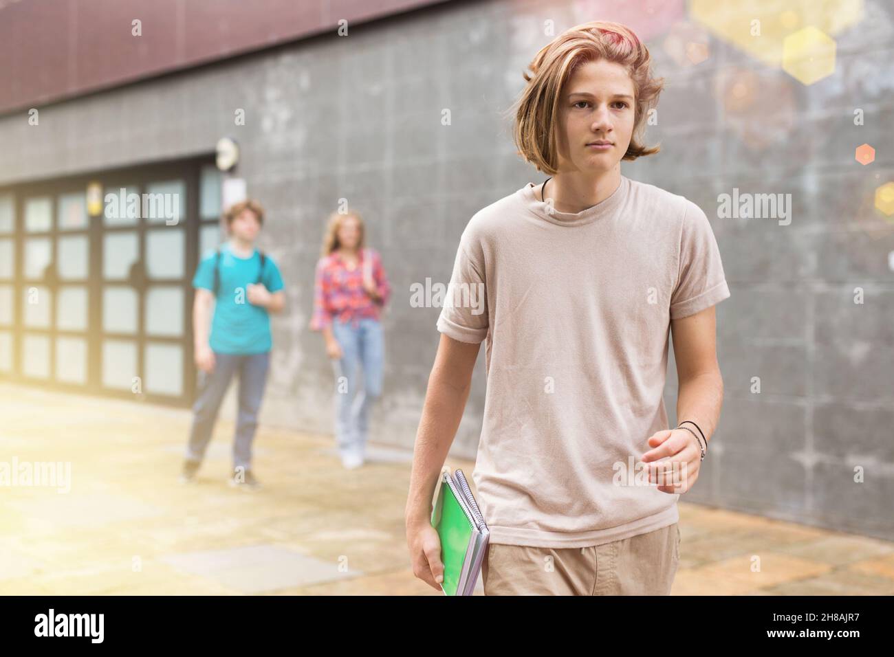 Teenager boy going home after school Stock Photo - Alamy