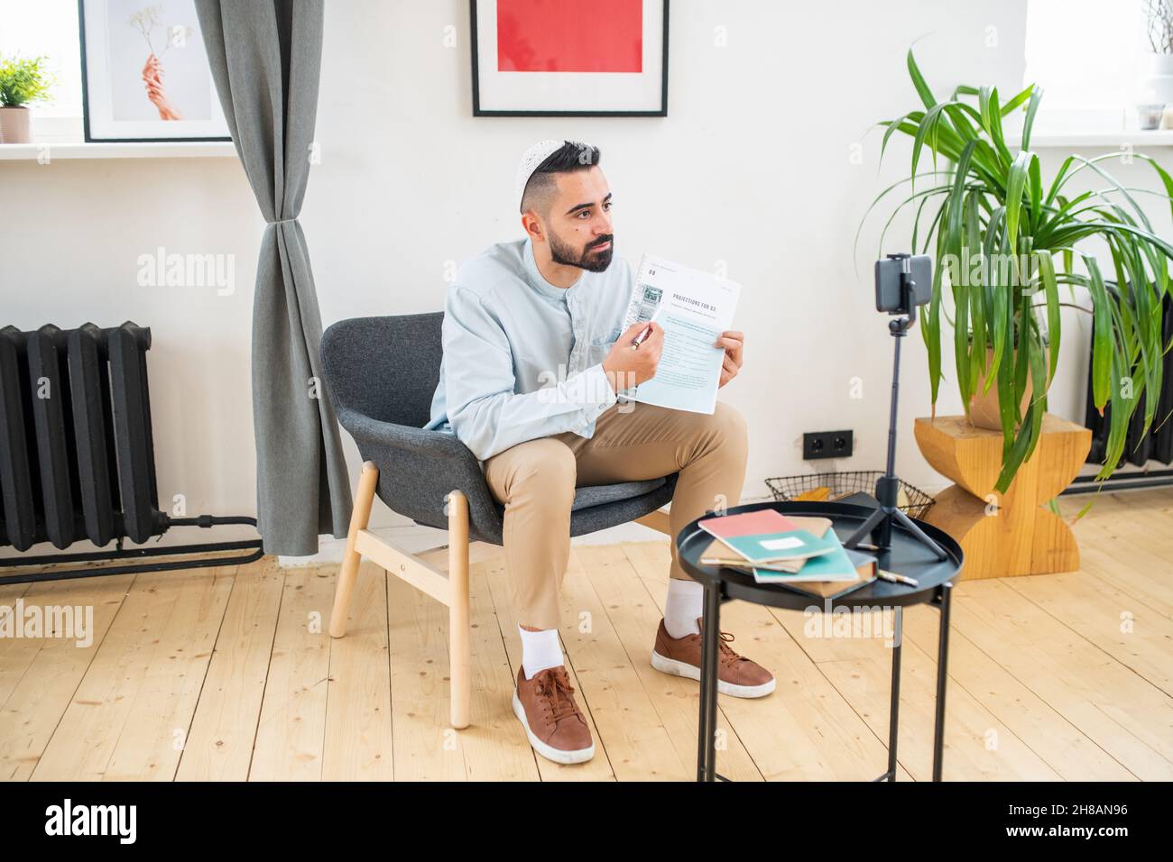 Young arabic muslim man sitting hi-res stock photography and images - Alamy