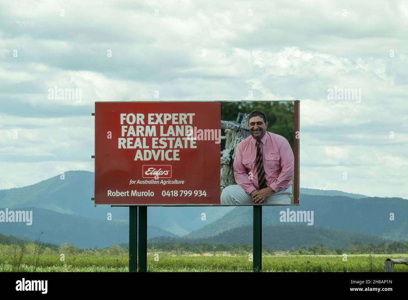 Bruce Highway, Townsville to Mackay, Queensland, Australia - November 2021: Real estate expert outdoor billboard Stock Photo