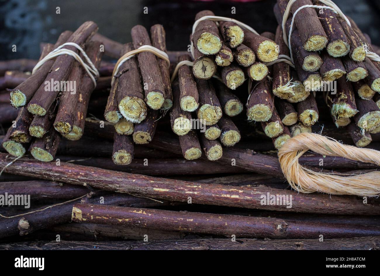 Dried sticks of liquorice root. Thre are displayed in its natural form Stock Photo