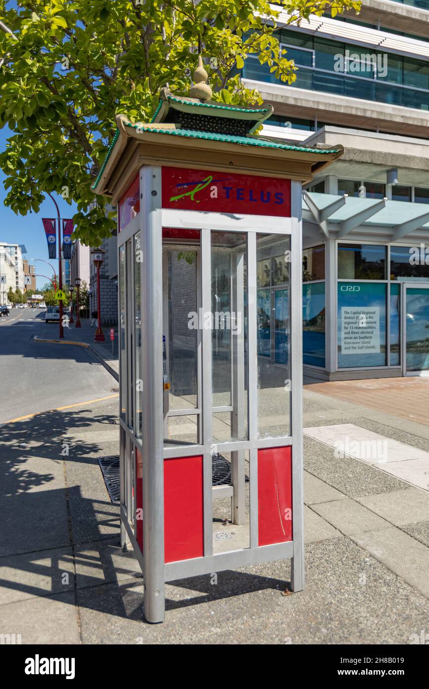 Public telephone booth on the street of Victoria BC, Canada. Stock Photo