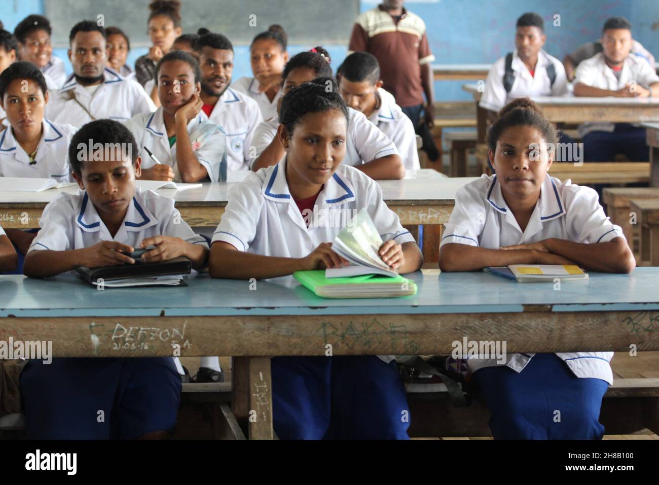 Female students at Kupuiano Secondary School in Central Province, Papua New Guinea listing to a presentation in 2018. Stock Photo