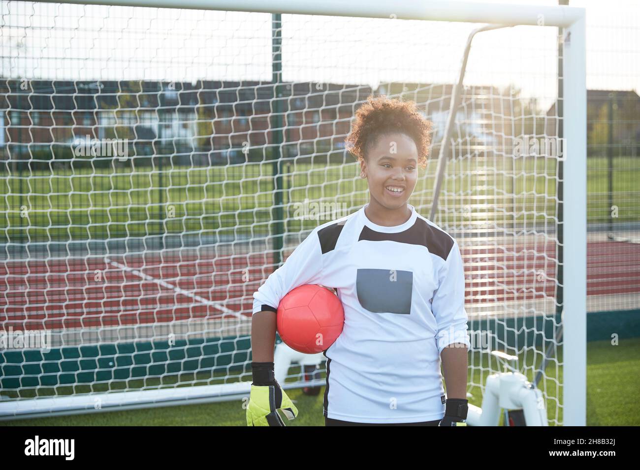 UK, Smiling female soccer goalie at goal Stock Photo Alamy