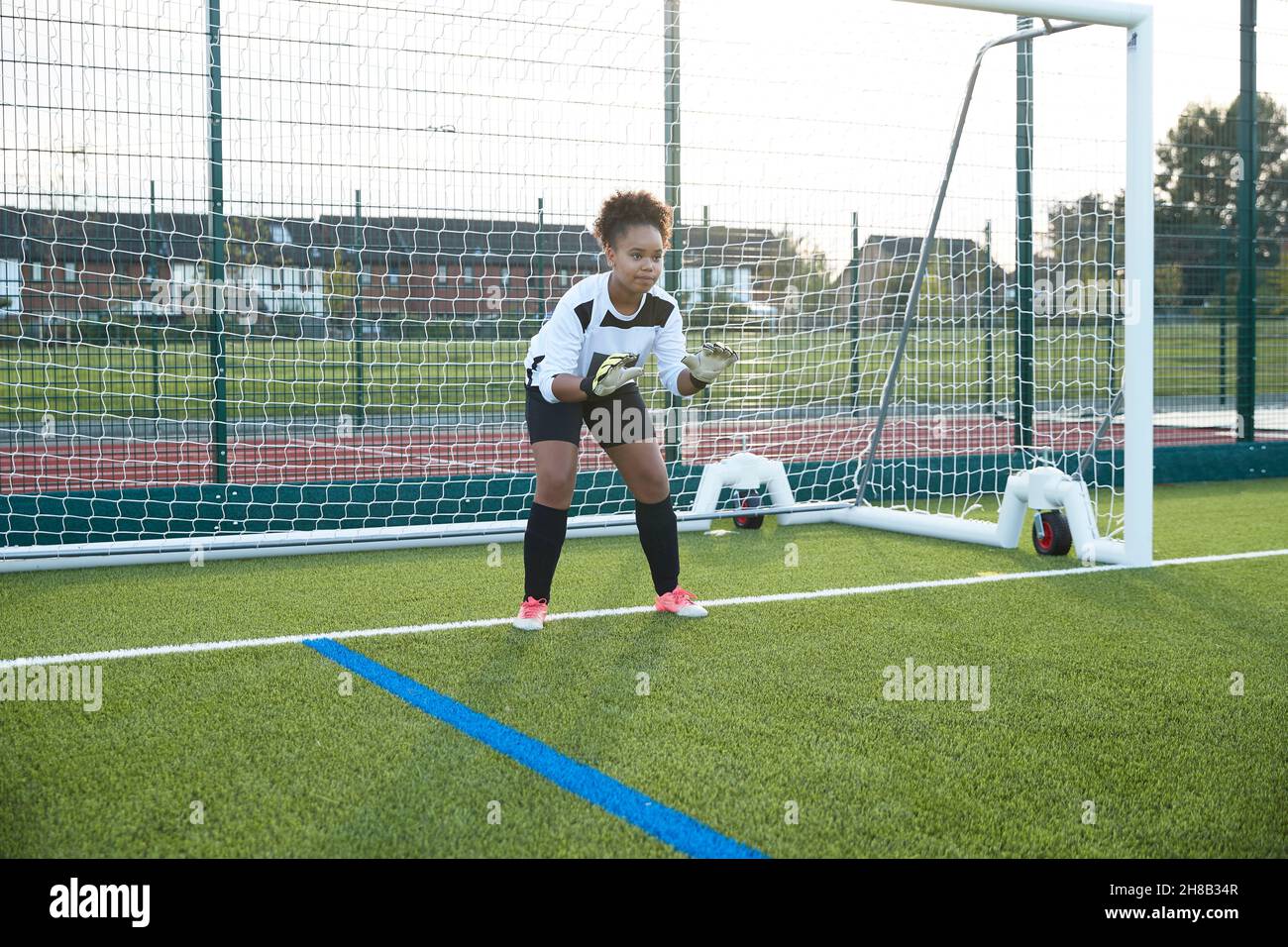 UK, Female soccer goalie defending goal Stock Photo Alamy