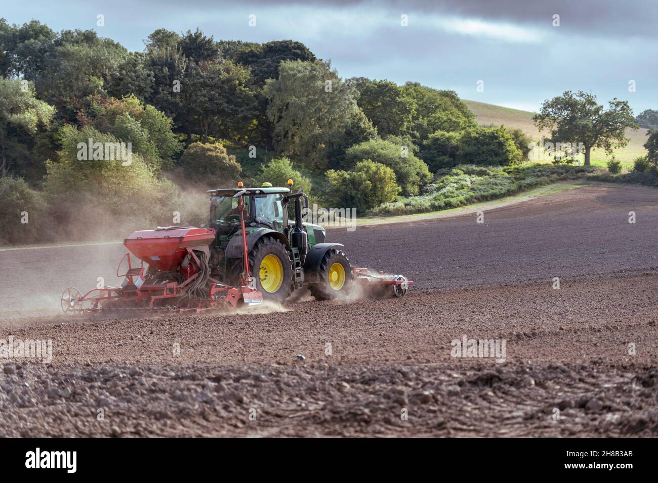 Tractor in plowed field Stock Photo