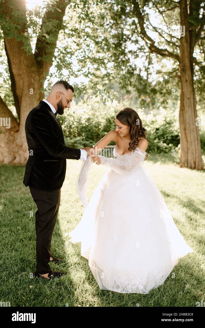 Bride and groom in park Stock Photo