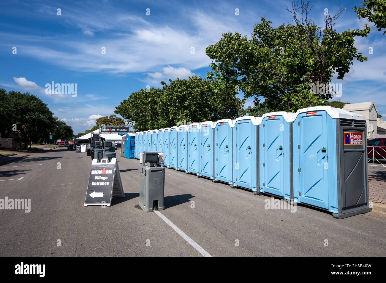 Waco, Texas - Oct. 21, 2021: Portable toilets and wash stations are set up at the IRONMAN Village for the inaugural Ironman Waco event October 23 and 24. Stock Photo