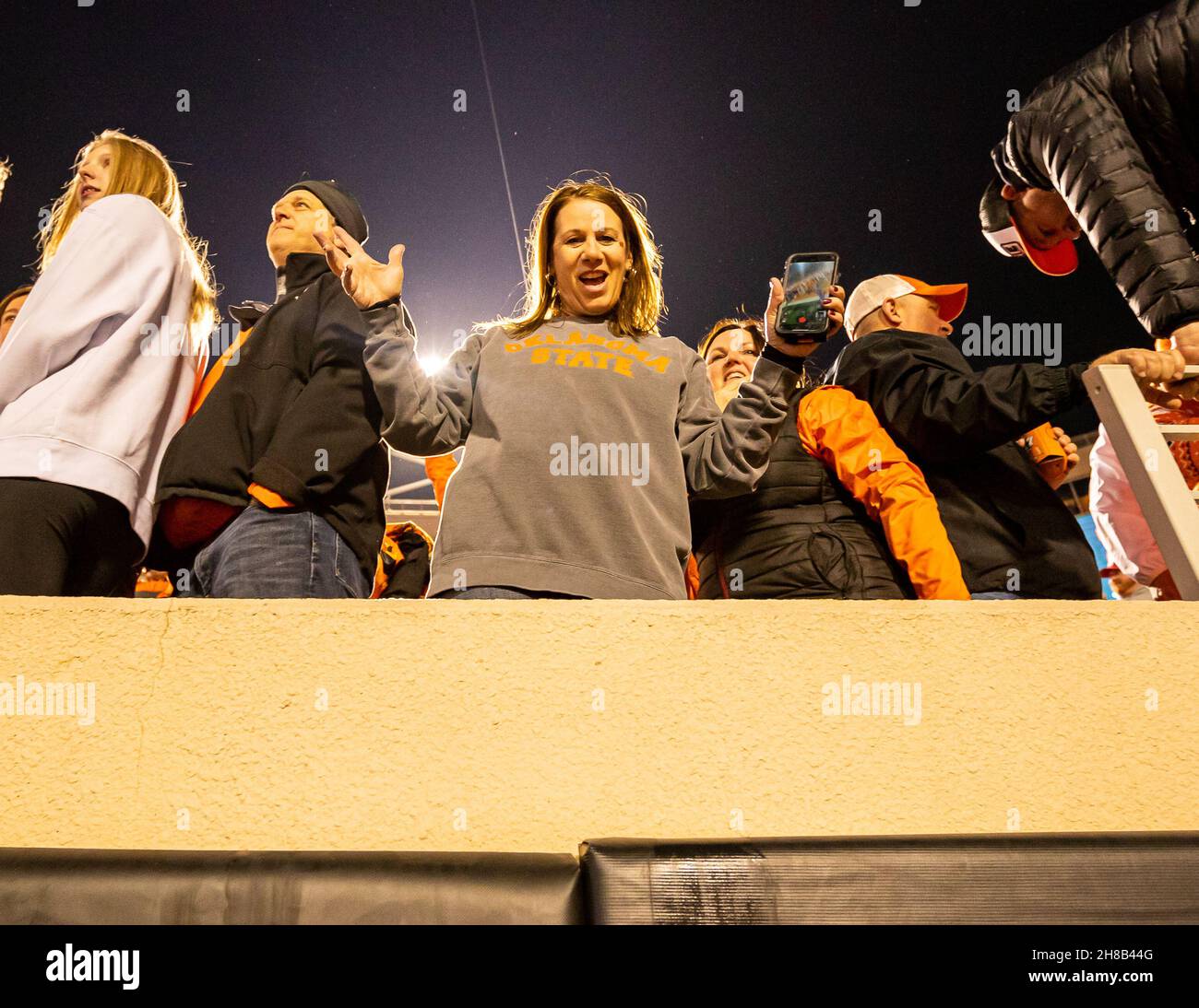 Stillwater, Oklahoma, USA. 27th Nov, 2021. Oklahoma State Cowboy celebrate after their 37-33 victory over the Oklahoma Sooners on Saturday, November 27, 2021 at Boone Pickens Stadium in Stillwater, Oklahoma. (Credit Image: © Nicholas Rutledge/ZUMA Press Wire) Stock Photo