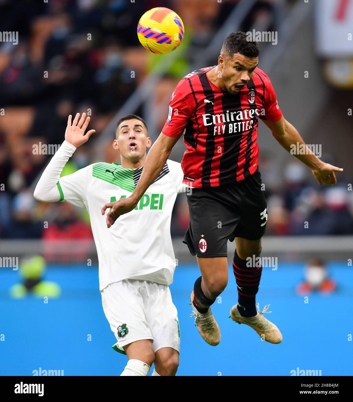 Milan, Italy. 28th Nov, 2021. AC Milan's Junior Messias (R) vies with  Sassuolo's Mert Muldur during a Serie A football match between AC Milan and  Sassuolo in Milan, Italy, Nov. 28, 2021.