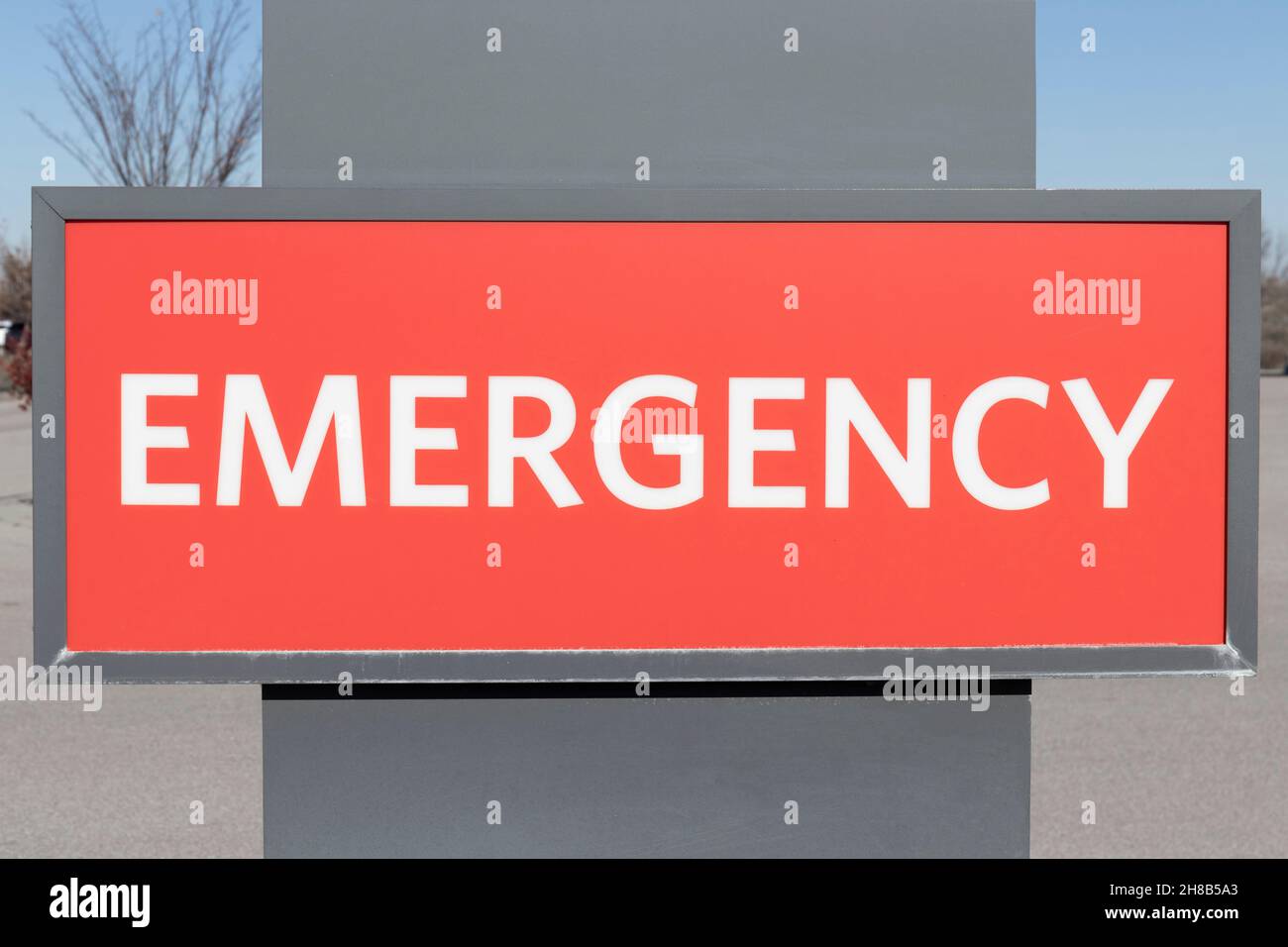 Emergency Entrance Sign for a Local Hospital in alert red. Stock Photo