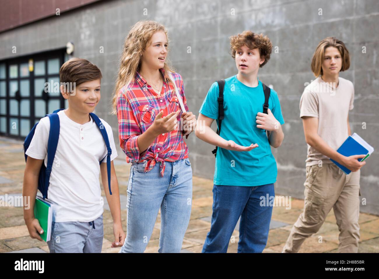 School friends walk after class Stock Photo - Alamy
