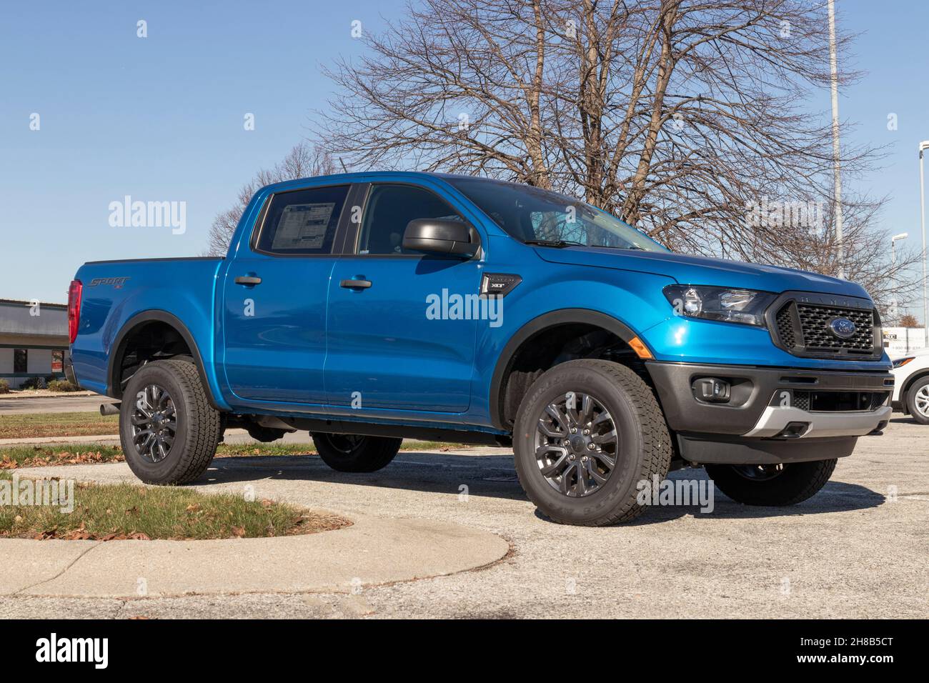 Fishers - Circa November 2021: Ford Ranger pickup truck display at a dealership. The Ranger nameplate has been used on multiple light duty trucks mode Stock Photo