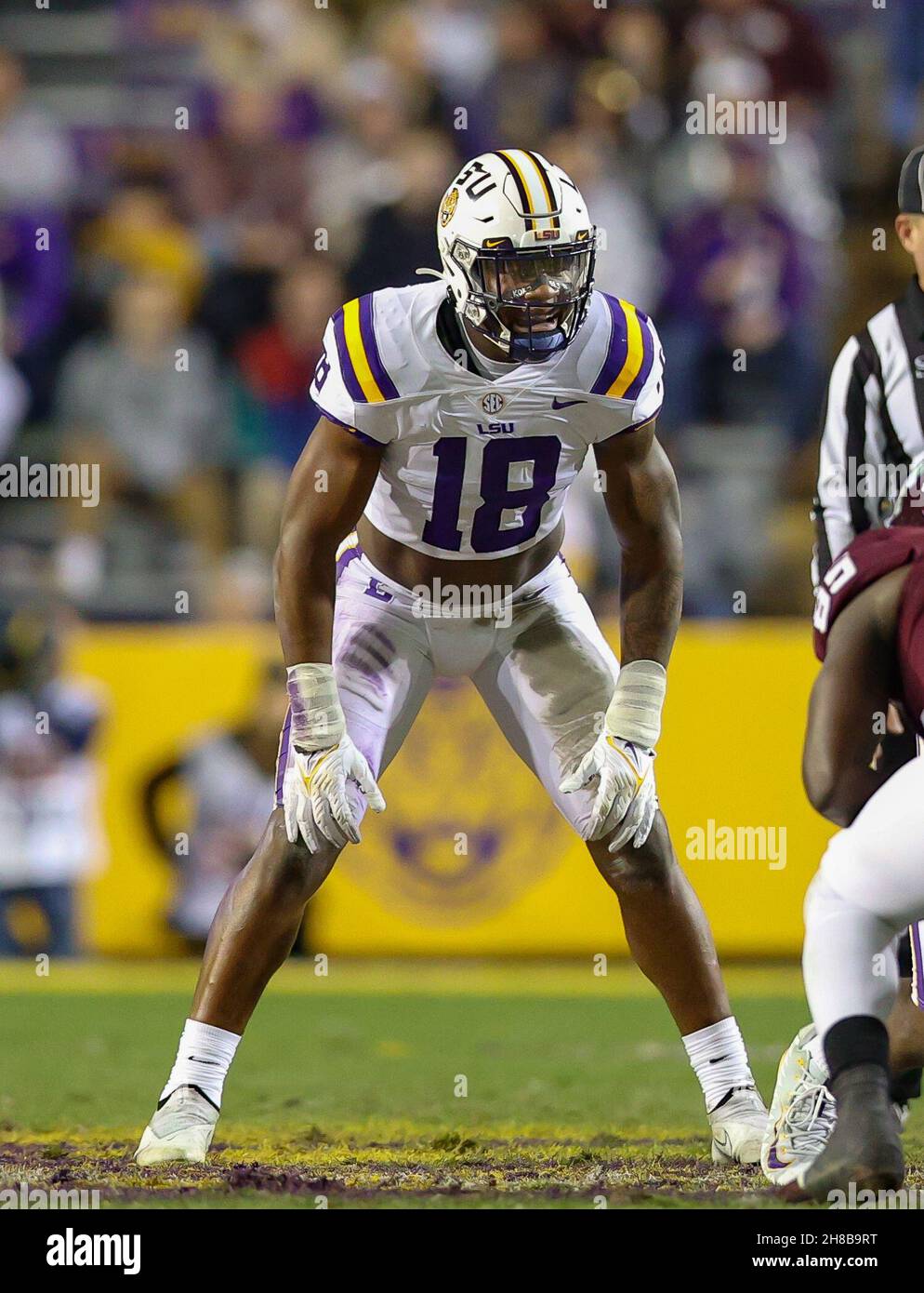 Baton Rouge, LA, USA. 27th Nov, 2021. LSU linebacker Damone Clark #18 lines up close to the LOS during the NCAA football game between the LSU Tigers and the Texas A&M Aggies at Tiger Stadium in Baton Rouge, LA. Kyle Okita/CSM/Alamy Live News Stock Photo
