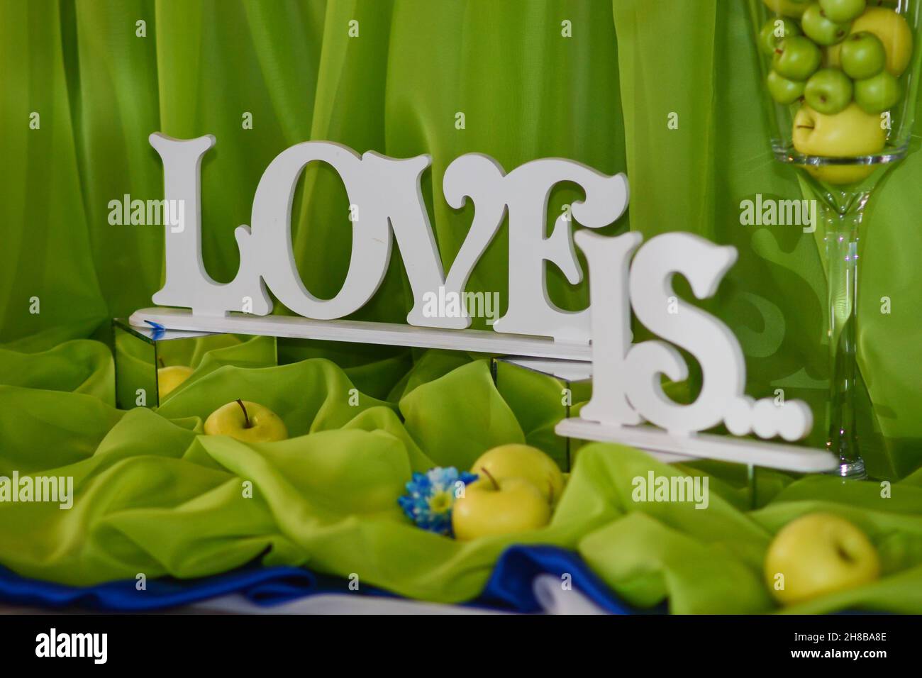 the inscription in wooden letters is love Stock Photo