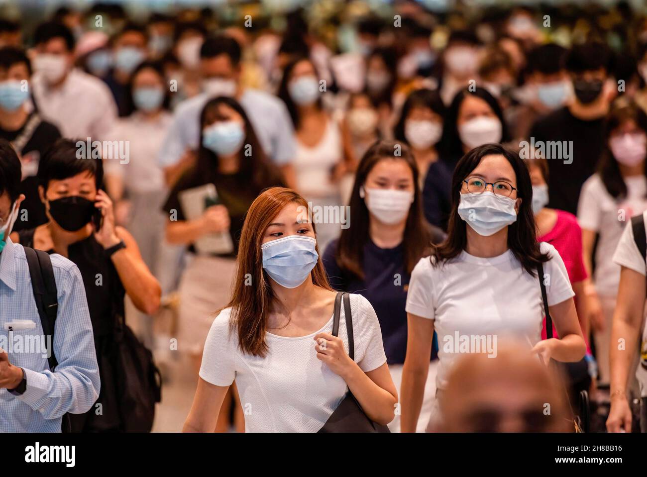 Hong Kong, China. 6th Oct, 2021. A large crowd of people is seen wearing face masks as they commute at the Central MTR subway station.The city of Hong Kong is on high alert as a heavily-mutated new Covid-19 variant known as the Omicron variant has been detected from a passenger traveling from South Africa. (Credit Image: © Budrul Chukrut/SOPA Images via ZUMA Press Wire) Stock Photo